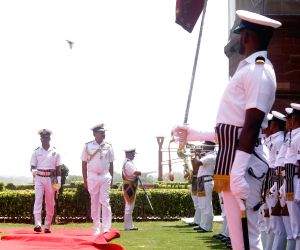 Admiral Dinesh Kumar Tripathi inspects a guard of honour before assuming charge as the 26th Navy chief